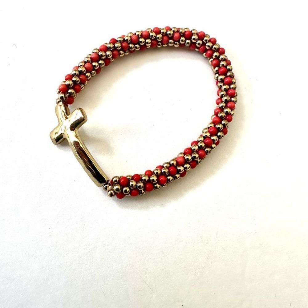 Gold tone and orange beaded stretchy cross bracelet